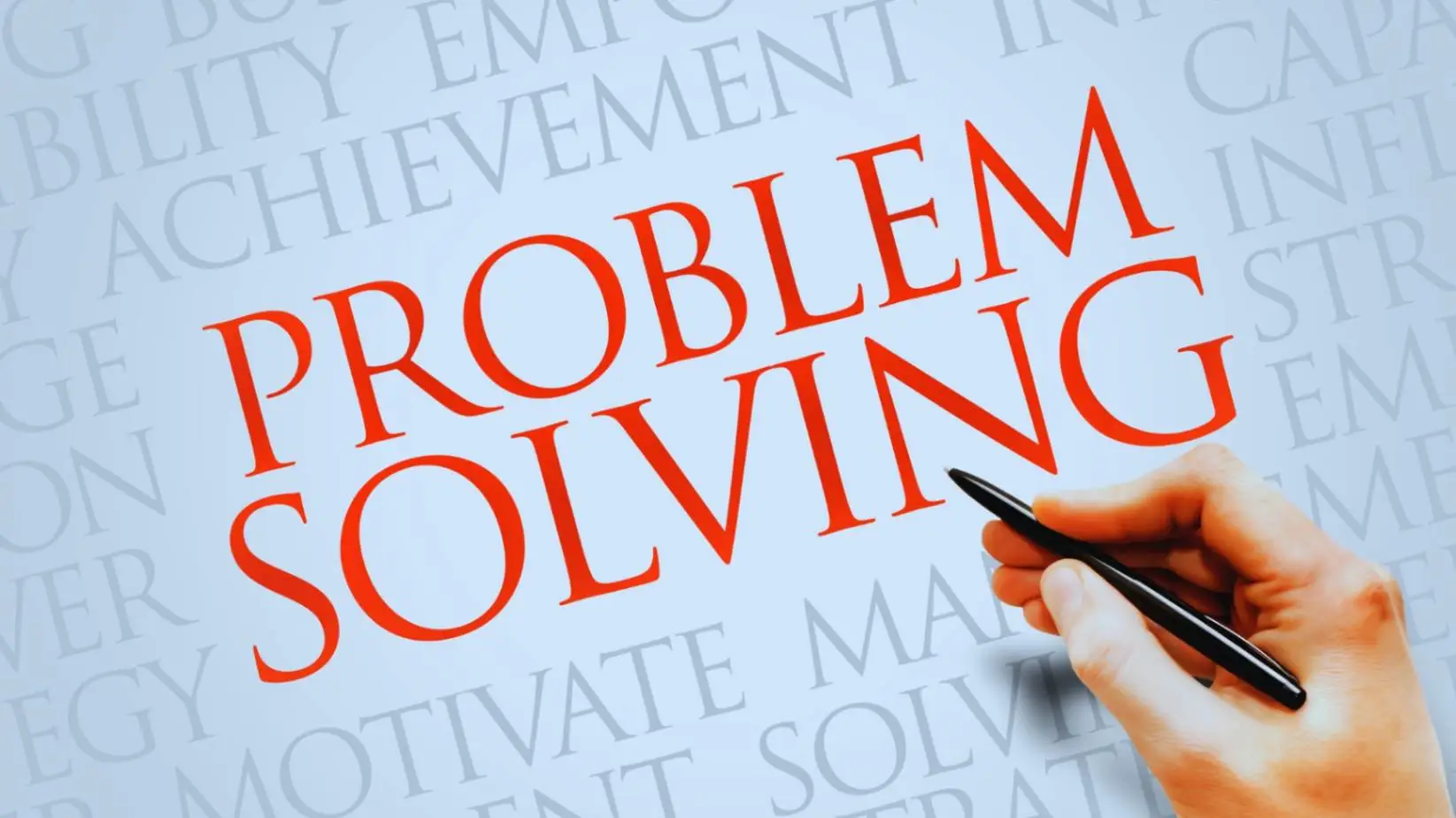 "Hand writing 'Problem Solving' in bold red letters on a white background with related motivational words like 'strategy', 'motivation', and 'achievement'."
